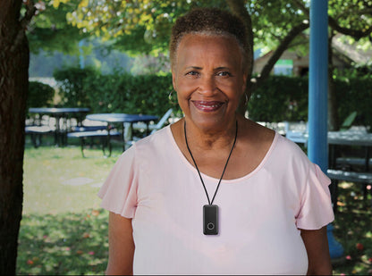 Woman wearing a device with Gemini logo and 'Brighton' branding in an outdoor setting.